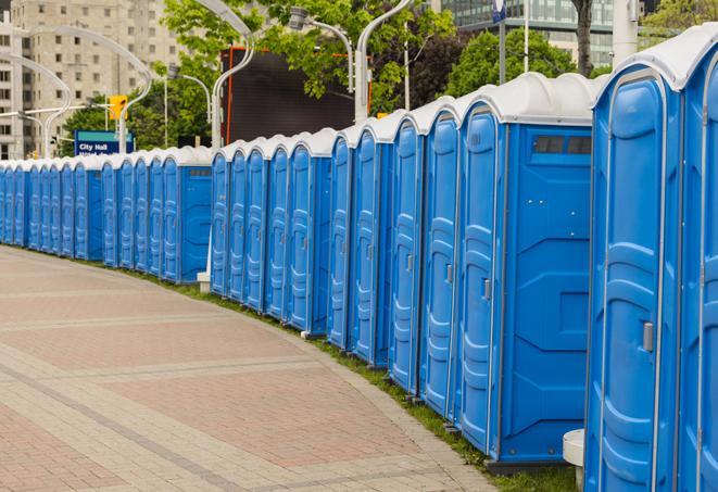 a row of portable restrooms at a trade show, catering to visitors with a professional and comfortable experience in East Rochester